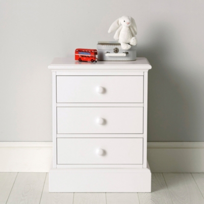 white dresser with matching nightstand