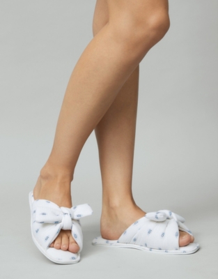white and blue slippers