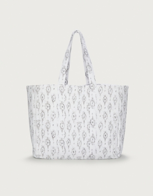 The white 2025 company tote bag