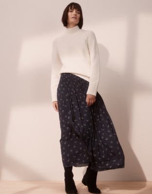 white sweater and floral skirt