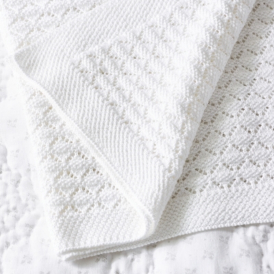 white cot blanket