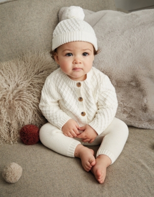 white knitted newborn hat