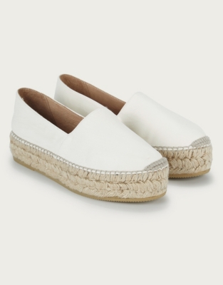 white leather flatforms