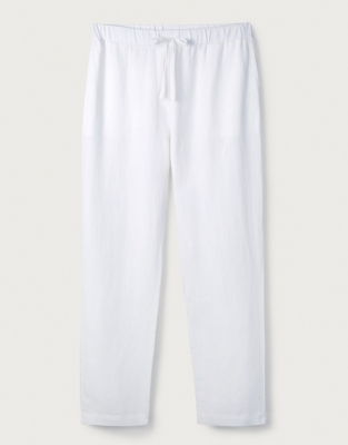 white tapered linen trousers