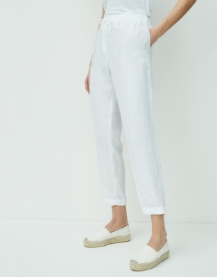 white tapered linen trousers