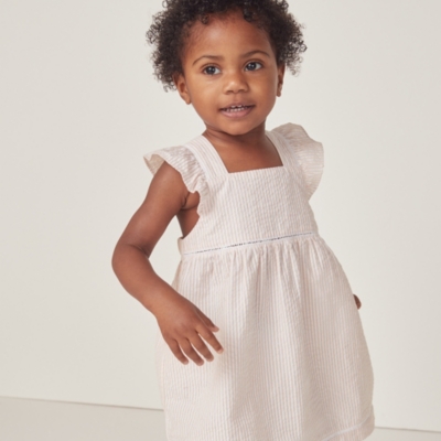Organic Cotton Seersucker Stripe Ruffle Pinafore Dress (0–18mths)