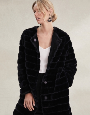 White company store fur coat