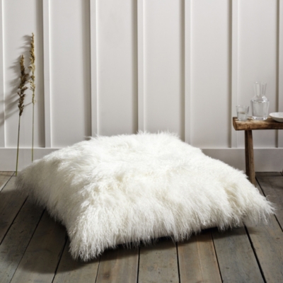 Sheepskin floor outlet cushion